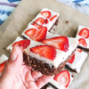 Paleo Brownie Protein Bars with Strawberry Coconut Frosting
